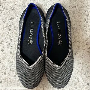 Rothy’s size 10 round toe flats. Black pattern with blue accent at back.
